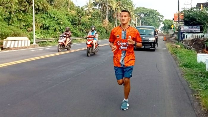 Raih Emas PON XX Papua, Pesilat Persinas ASAD Khoirudin Mustakim Penuhi Nazar Lari Salatiga-Klaten
